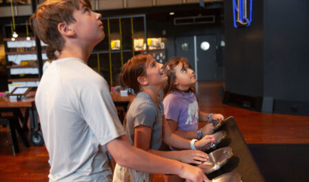 Children engaging with exhibit in the Grand Atrium at MOHAI in downtown Seattle, WA.