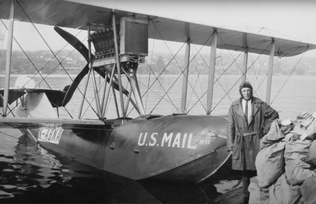 Historic black and white photo of the Boeing B-1 airplane with pilot, Eddie Hubbard.