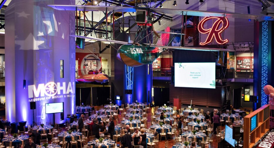 Guests mingling during an event in the Faye G. Allen Grand Atrium at MOHAI.