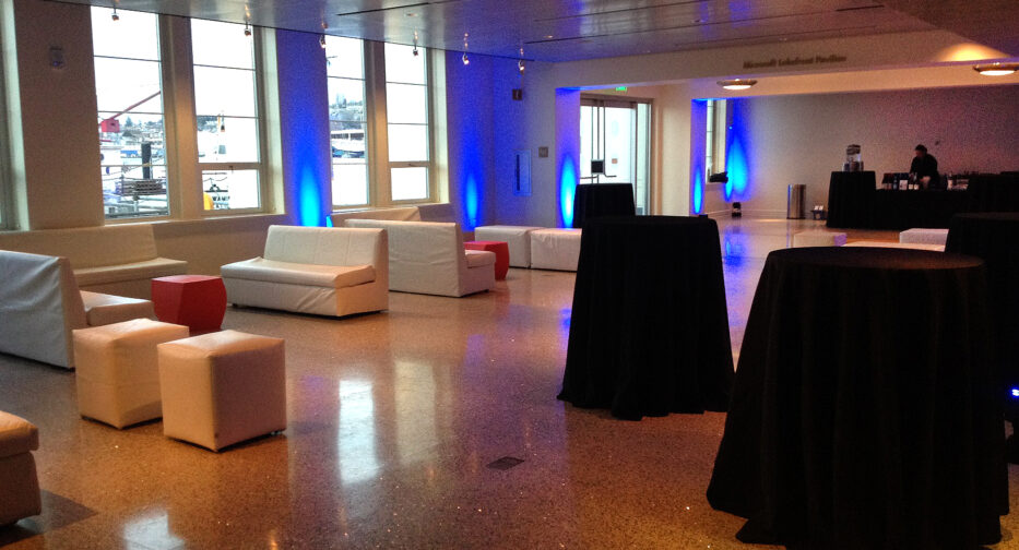 The Microsoft Lakefront Pavilion at MOHAI with a variety of tables and chairs.