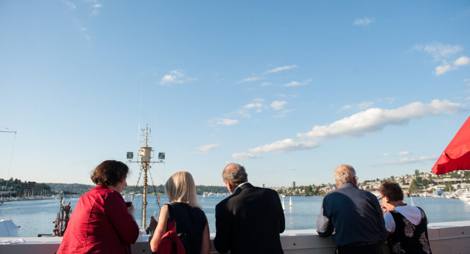 People enjoying the view from the Stack Family Lakeview Terrace.