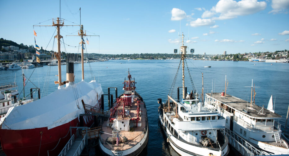 The view of Lake Union in downtown Seattle, WA from the Stack Family Lakeview Terrace. Multiple docked boats are visible in the foreground.