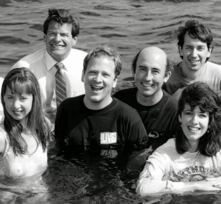Smiling Almost Live! cast photographed in water.