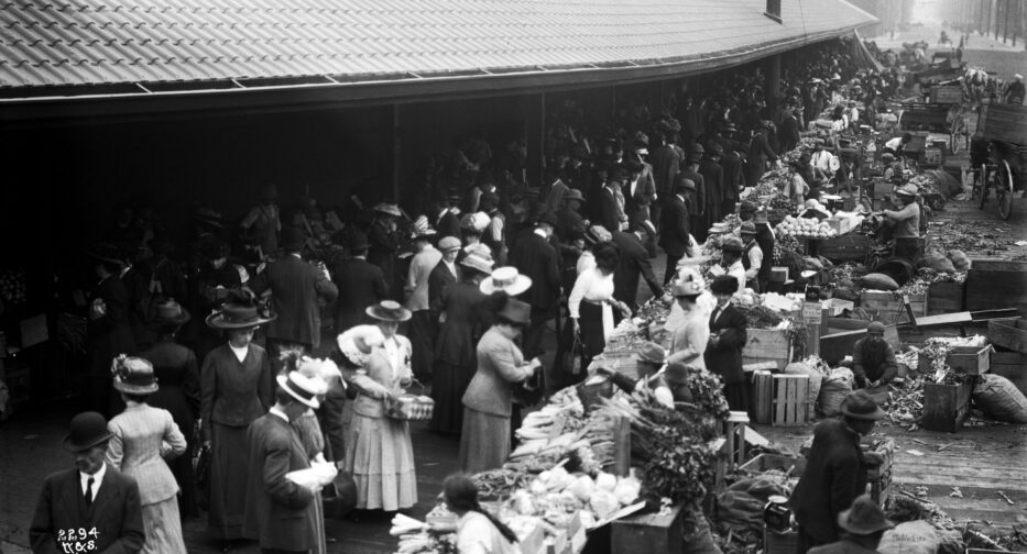 A historic 1911 photo of people shopping at Pike Place Market in Seattle.