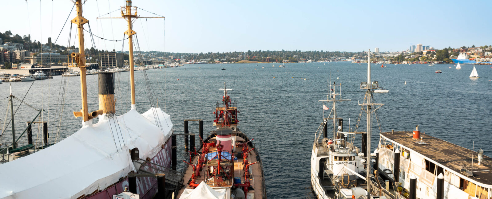 Four ships docked on Lake Union in downtown Seattle.
