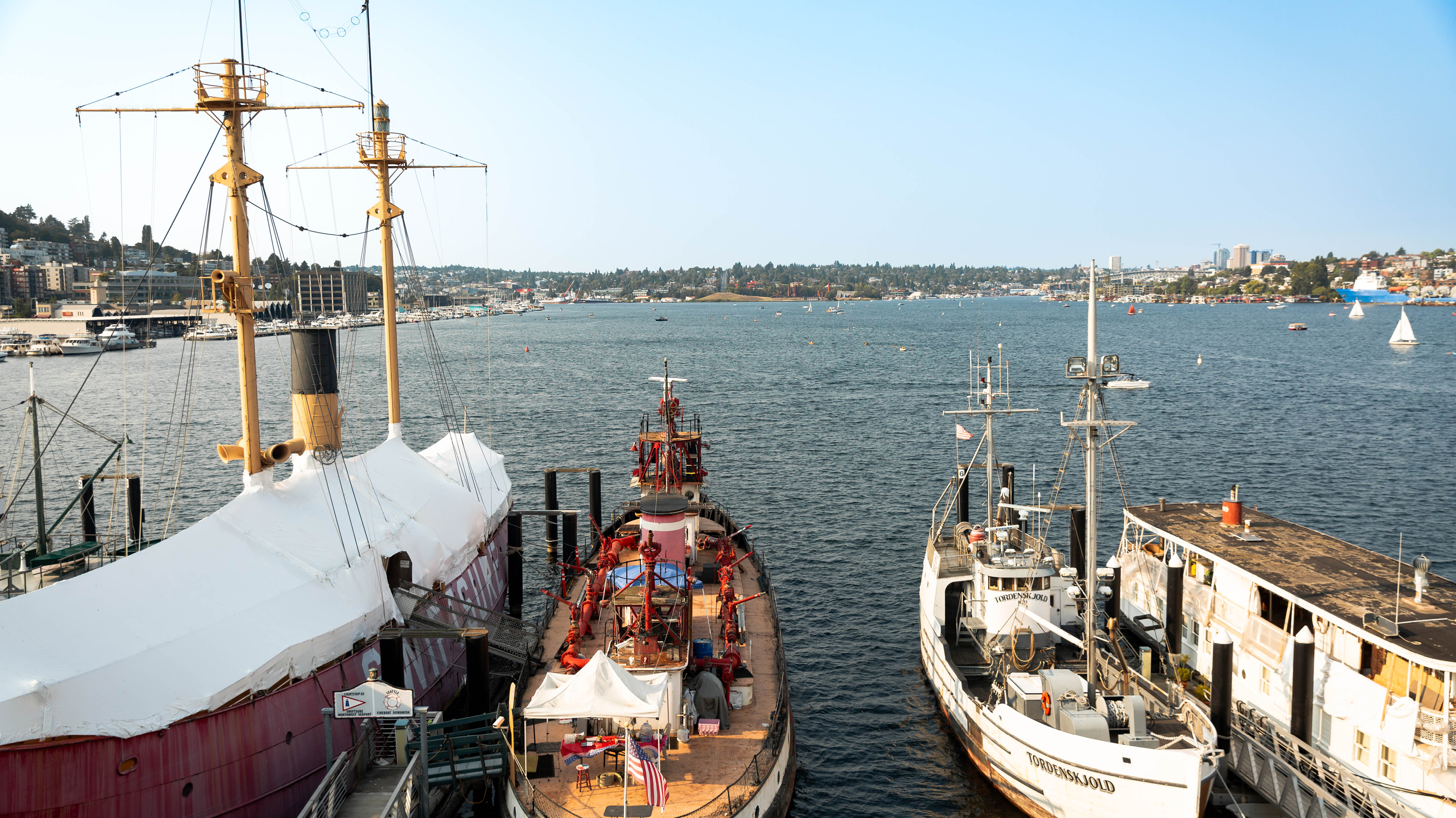 Four ships docked on Lake Union in downtown Seattle.
