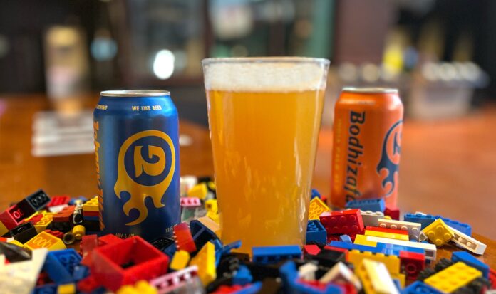 Georgetown Brewing beer nestled among colorful LEGO bricks.