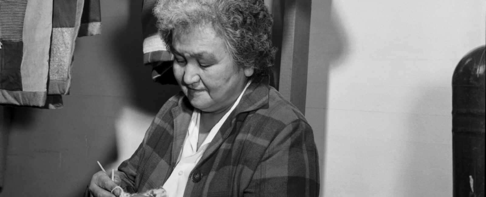 Lillian Jones knitting socks at thrift store