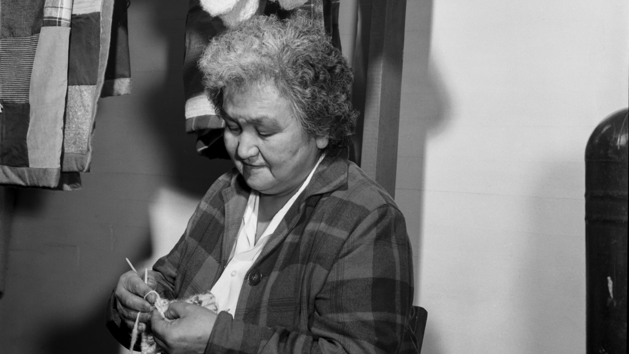 Lillian Jones knitting socks at thrift store