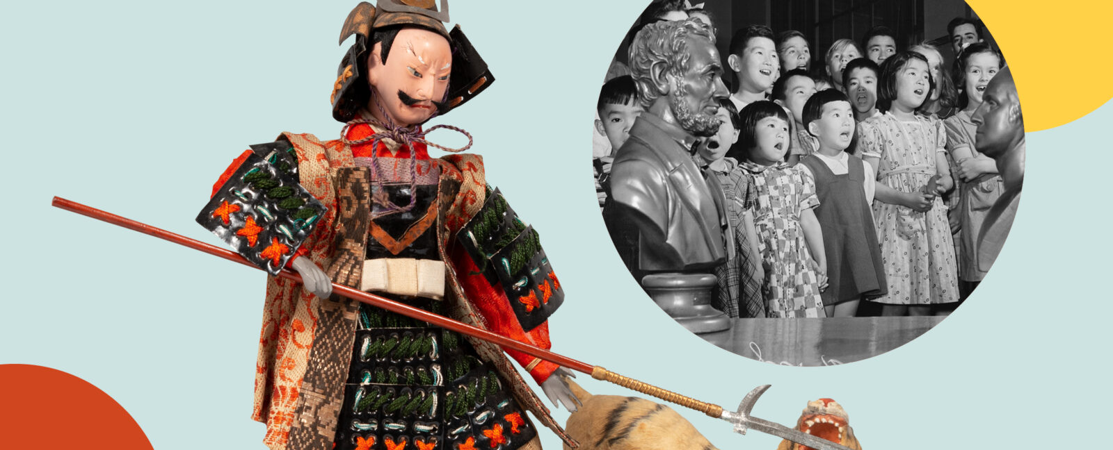 A doll in traditional Japanese armor fending off a tiger with a pike. Inset shows young school children singing adjacent to busy of Abraham Lincoln.