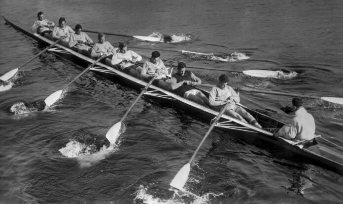 Mens rowing team on the water.