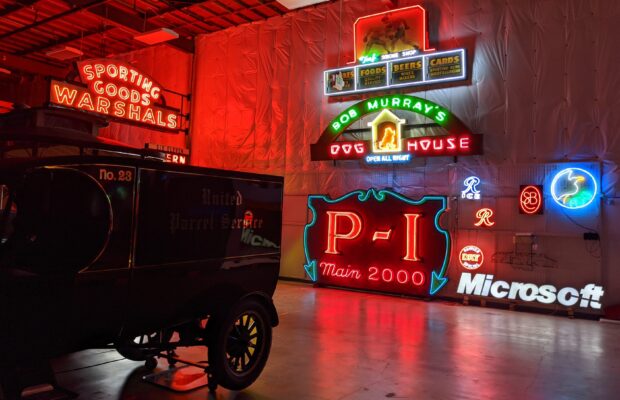 Neon signs in MOHAI collection including Bob Murray's Dog House, Microsoft, Warshal's Sporting Goods, and others.
