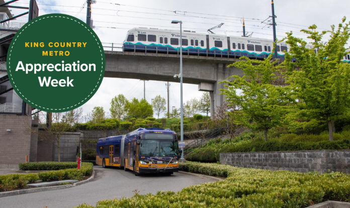 Link light rail train passing over an elevated track with metro bus passing underneath.