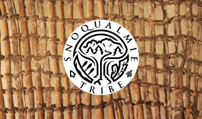 Snoqualmie Tribe logo over a woven bamboo mat.