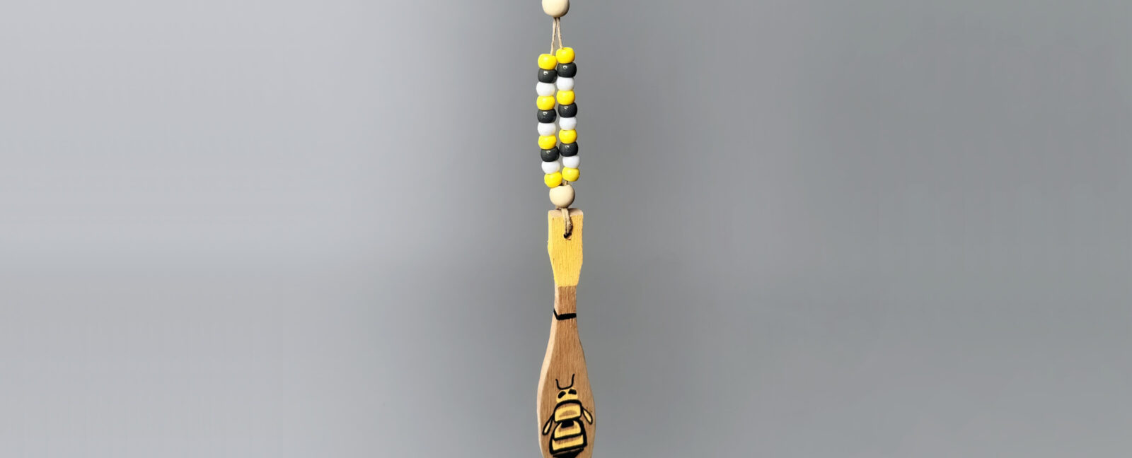 Wooden necklace craft with yellow