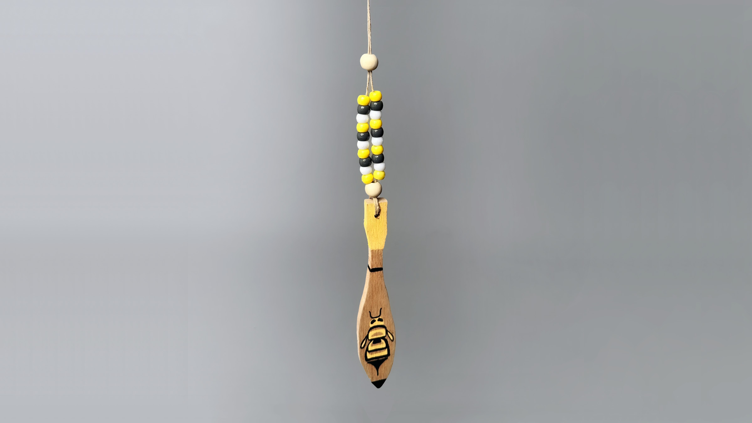 Wooden necklace craft with yellow