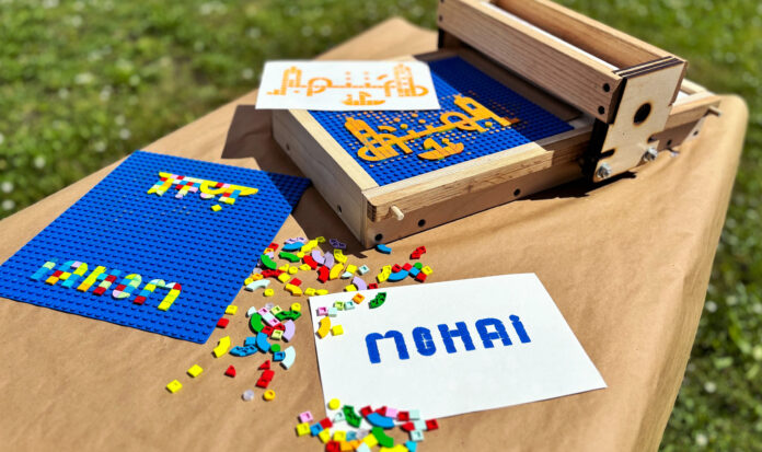 A LEGO print making tool with many colorful