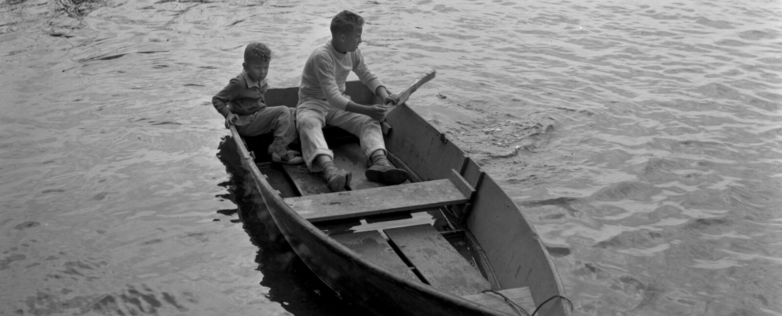 Butch Smith and Sonny Norris sitting in rowboat