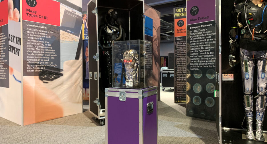 Metallic Terminator head displayed in a glass case at the Artificial Intelligence: Your Mind & The Machine museum exhibit.