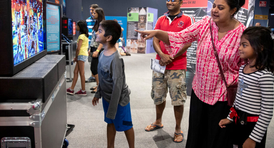 Family engaging with artificial intelligence activities.