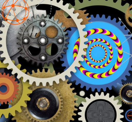 A collection of multi-colored gears used as the logo for the Artificial Intelligence: Your Mind & The Machine museum exhibit.