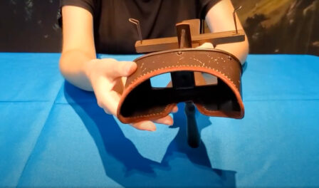An antique, wooden stereoscope used for viewing a stereoscopic pair of separate images as a single, three-dimensional image.