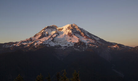 Mt. Rainier against a blue sky.