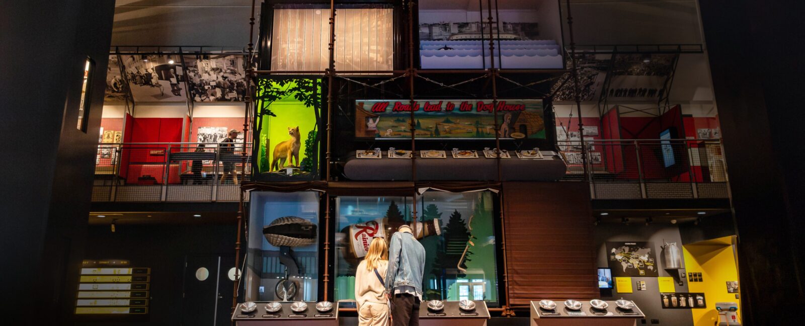 A couple explores an interactive exhibit in the Grand Atrium at MOHAI.