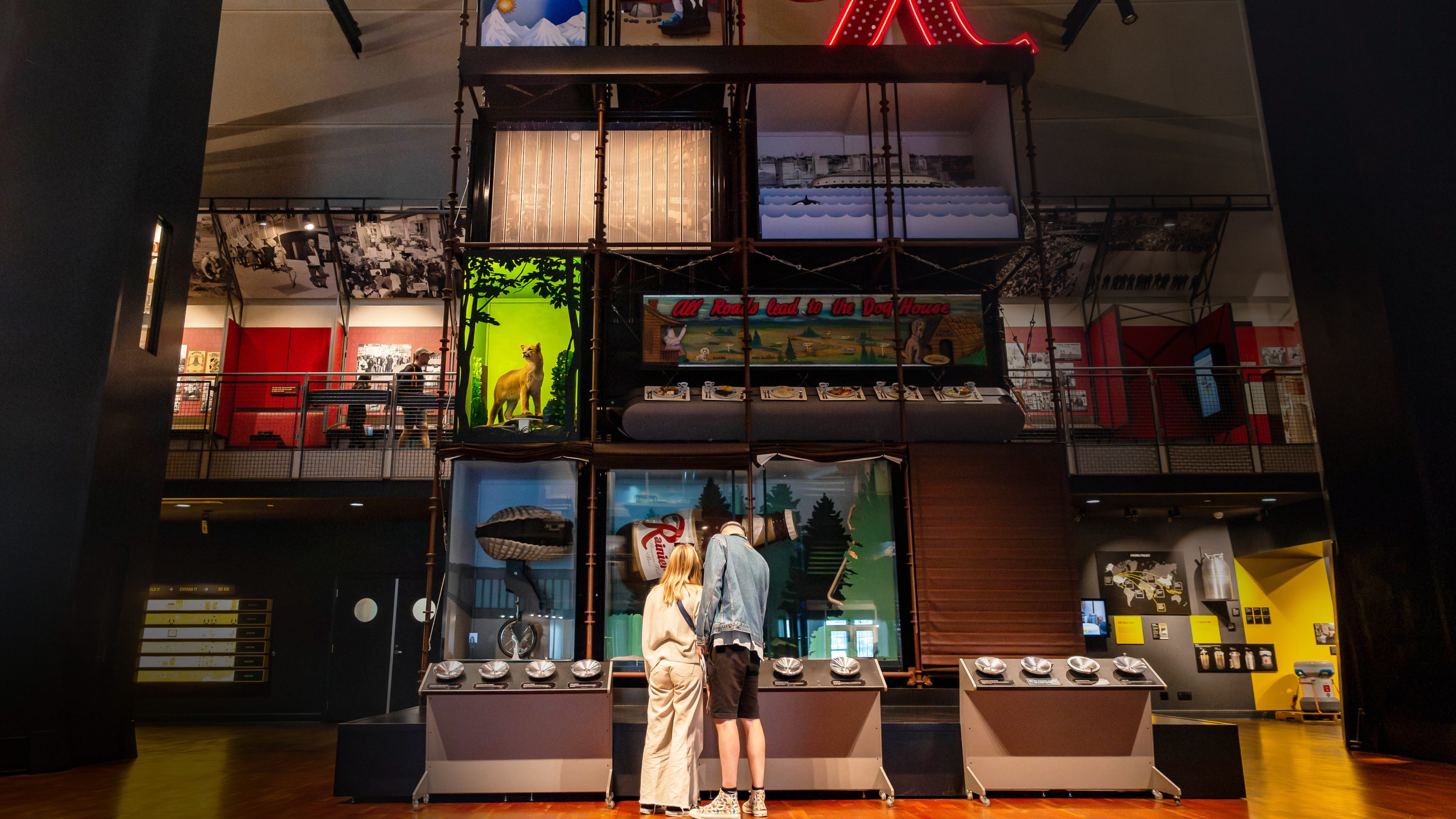 A couple explores an interactive exhibit in the Grand Atrium at MOHAI.