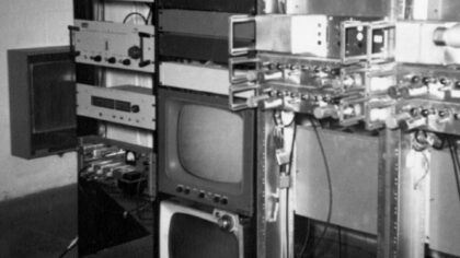 Black and white photo of early rack mounted monitor and television tube equipment.