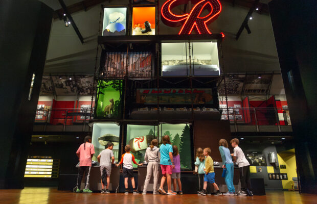 A group of children exploring MOHAI in the Grand Atrium.