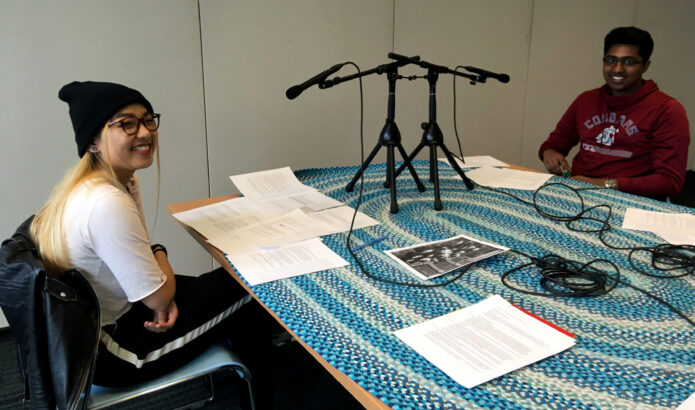Two member of the MOHAI Youth Advisory record an episode of the Rainy Day History podcast.
