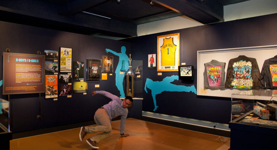 A visitor break dancing in The Legacy of Seattle Hip-Hop exhibit at MOHAI.