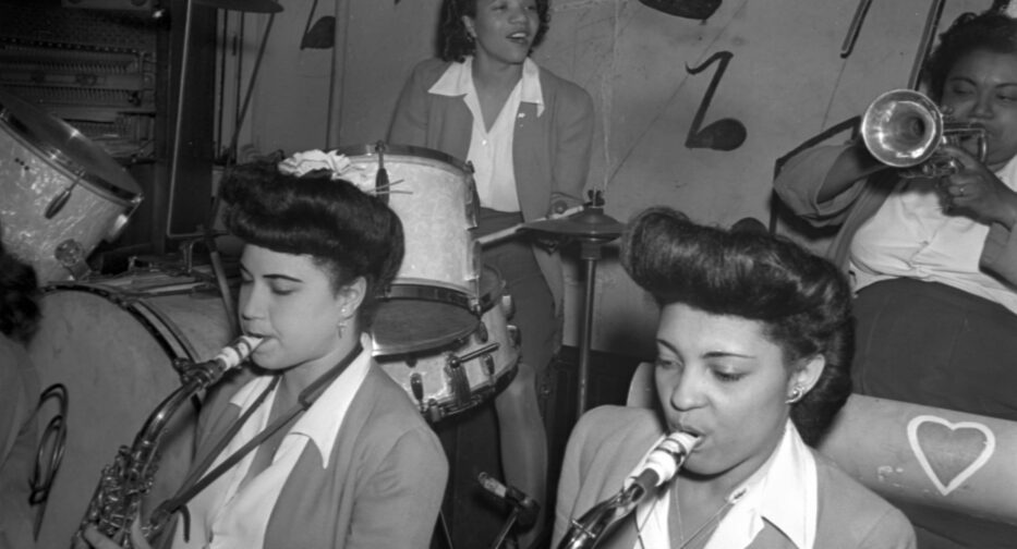 Sweethearts of Rhythm perform in Seattle ca. 1946. A trumpet player, a drummer, and two saxophone players are visible.