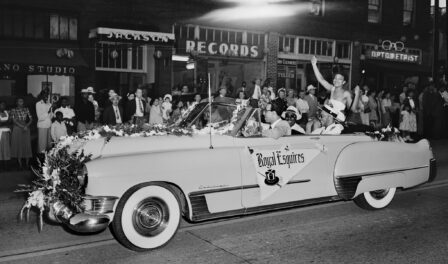 Festival queen waving from car during parade, Seattle, circa 1950.