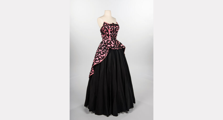 A two-piece, pink and black ball gown (House of Schiaparelli, ca. 1951) from the couture house of Elsa Schiaparelli, likely during Hubert de Givenchy's design tenure.