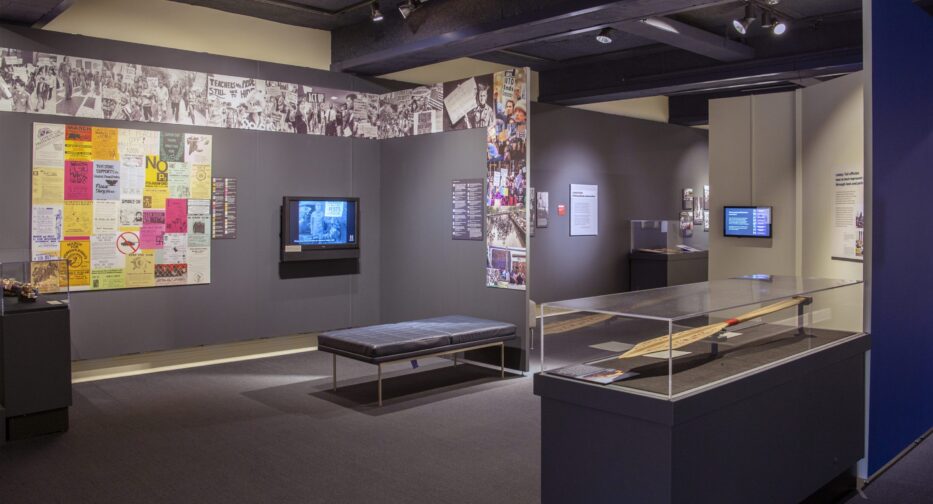 Wide view of Stand Up Seattle exhibit showing various photos and displays.