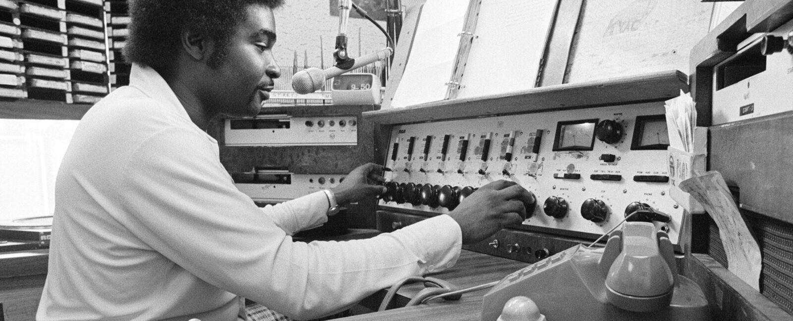 Robert L. Scott in booth at KYAC radio station
