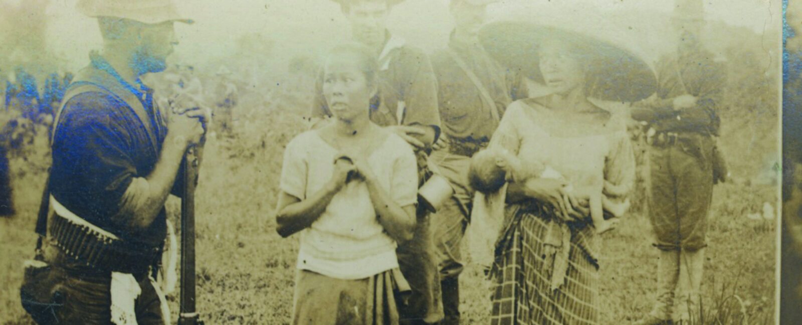 Military men confront Asian civilians.