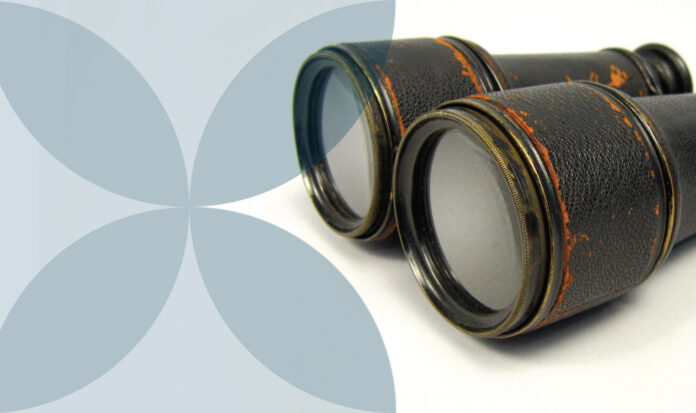 A set of binoculars pointing from right to left.