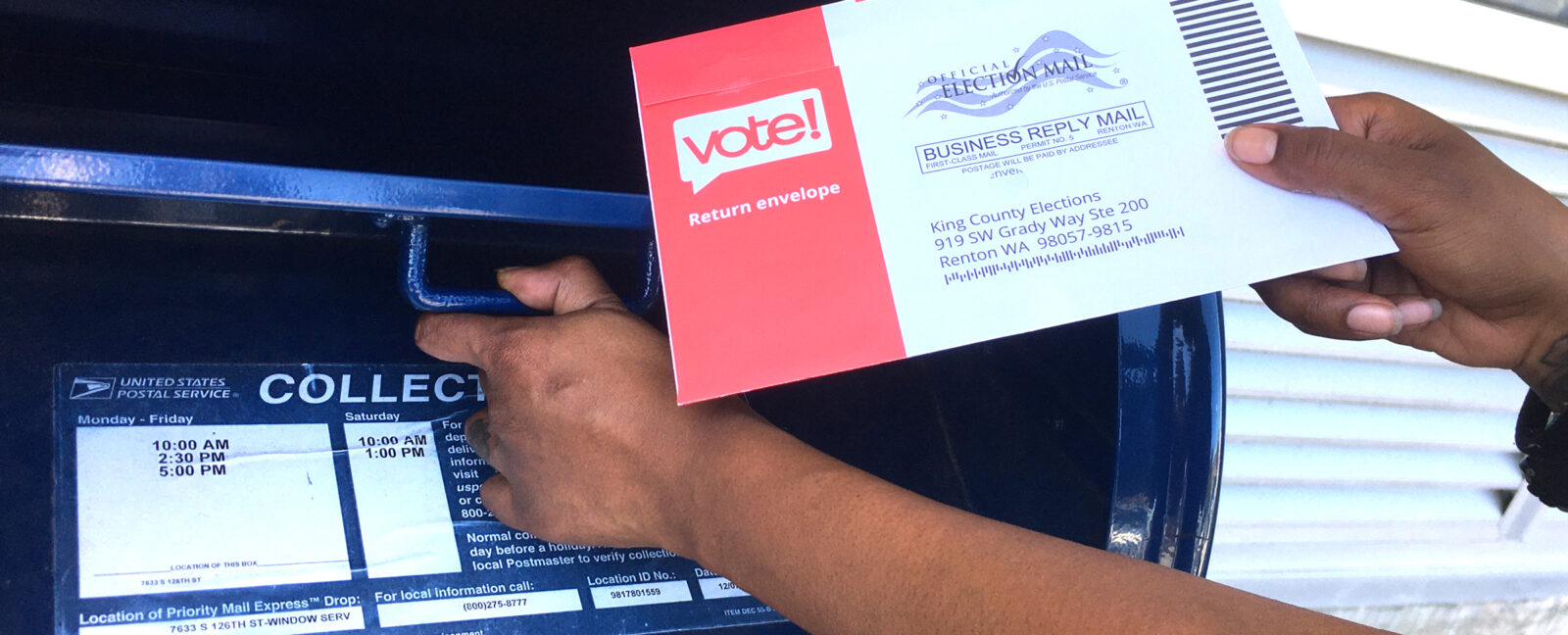 Voter places voting pamphlet in mailbox.