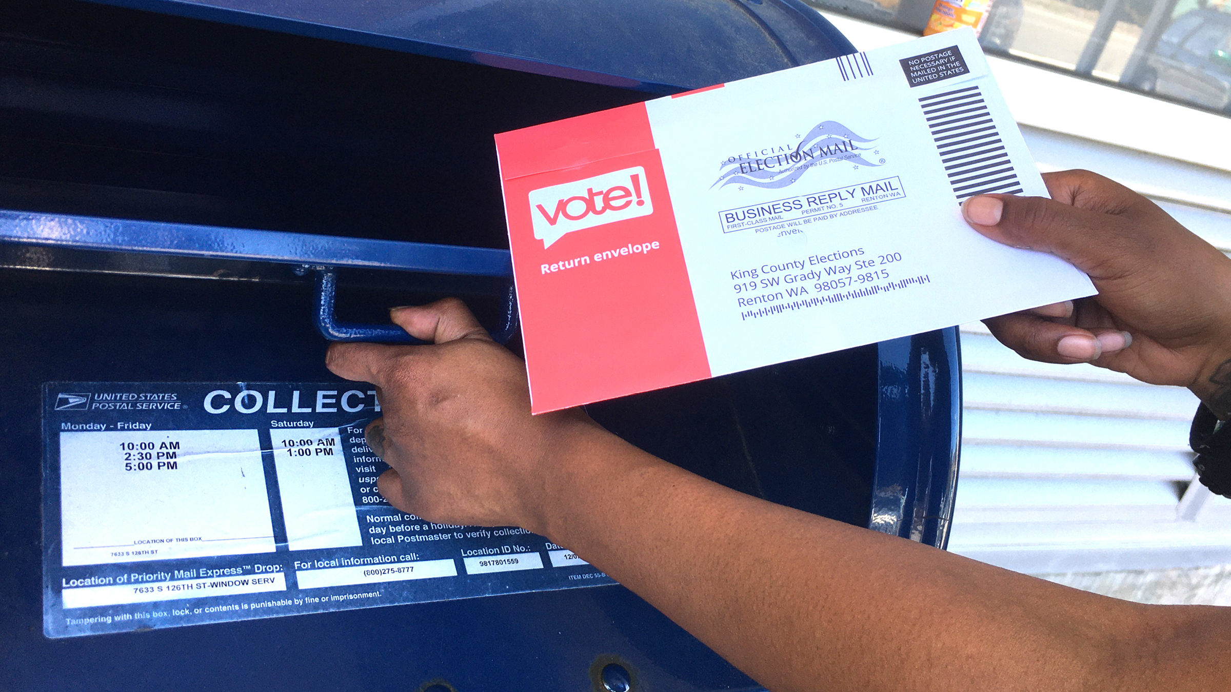 Voter places voting pamphlet in mailbox.