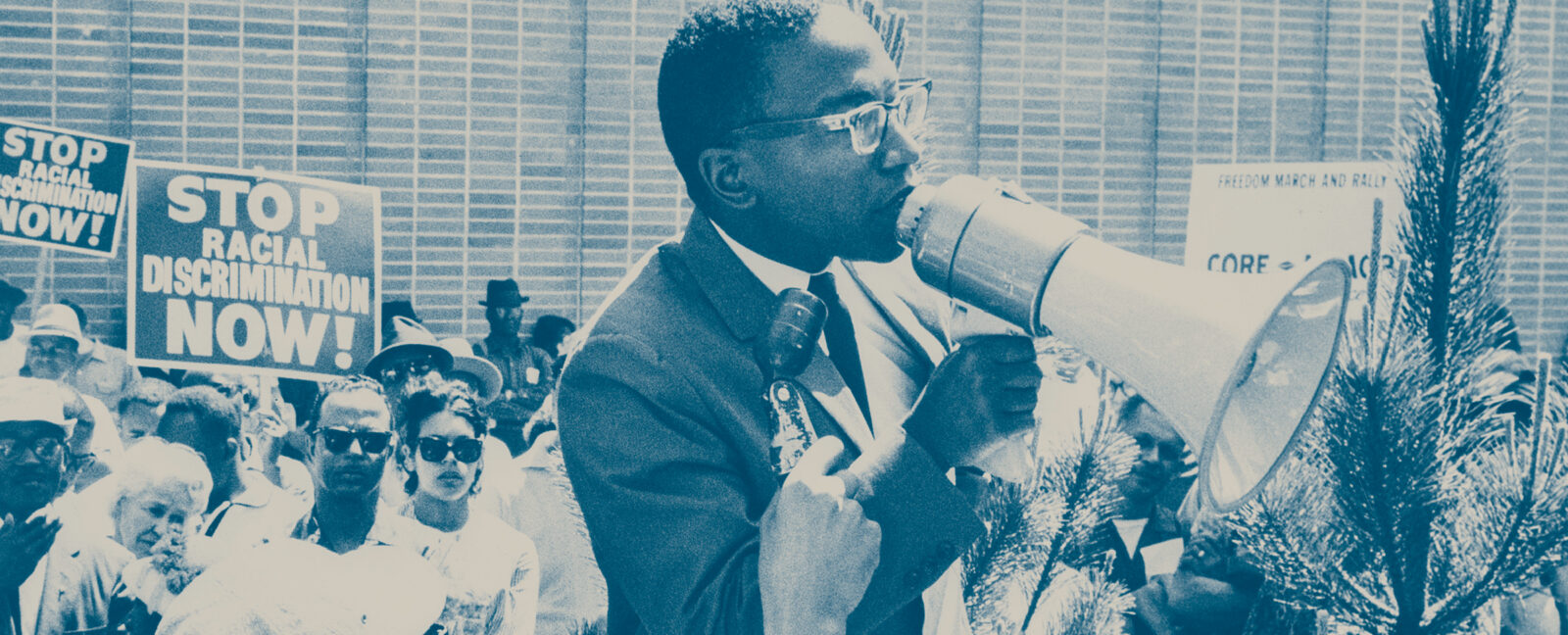 Reginald Alleyne speaking to crowd at Westlake Mall