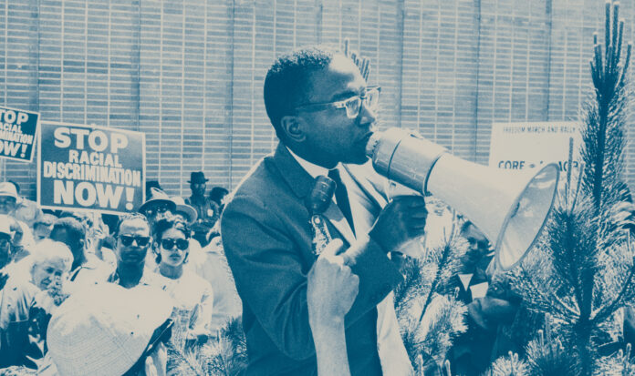 Reginald Alleyne speaking to crowd at Westlake Mall