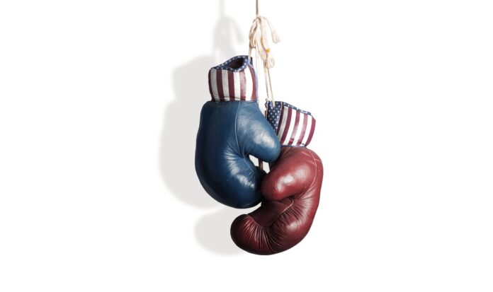 Hanging boxing gloves. One red