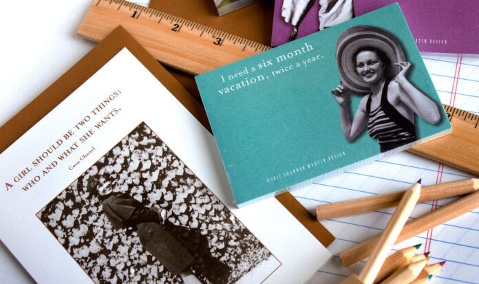 A collection of objects including a ruler and papers reading
