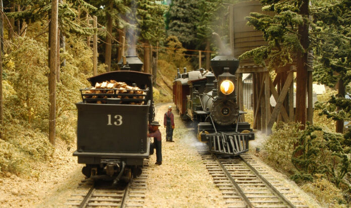 Two model trains on parallel tracks.