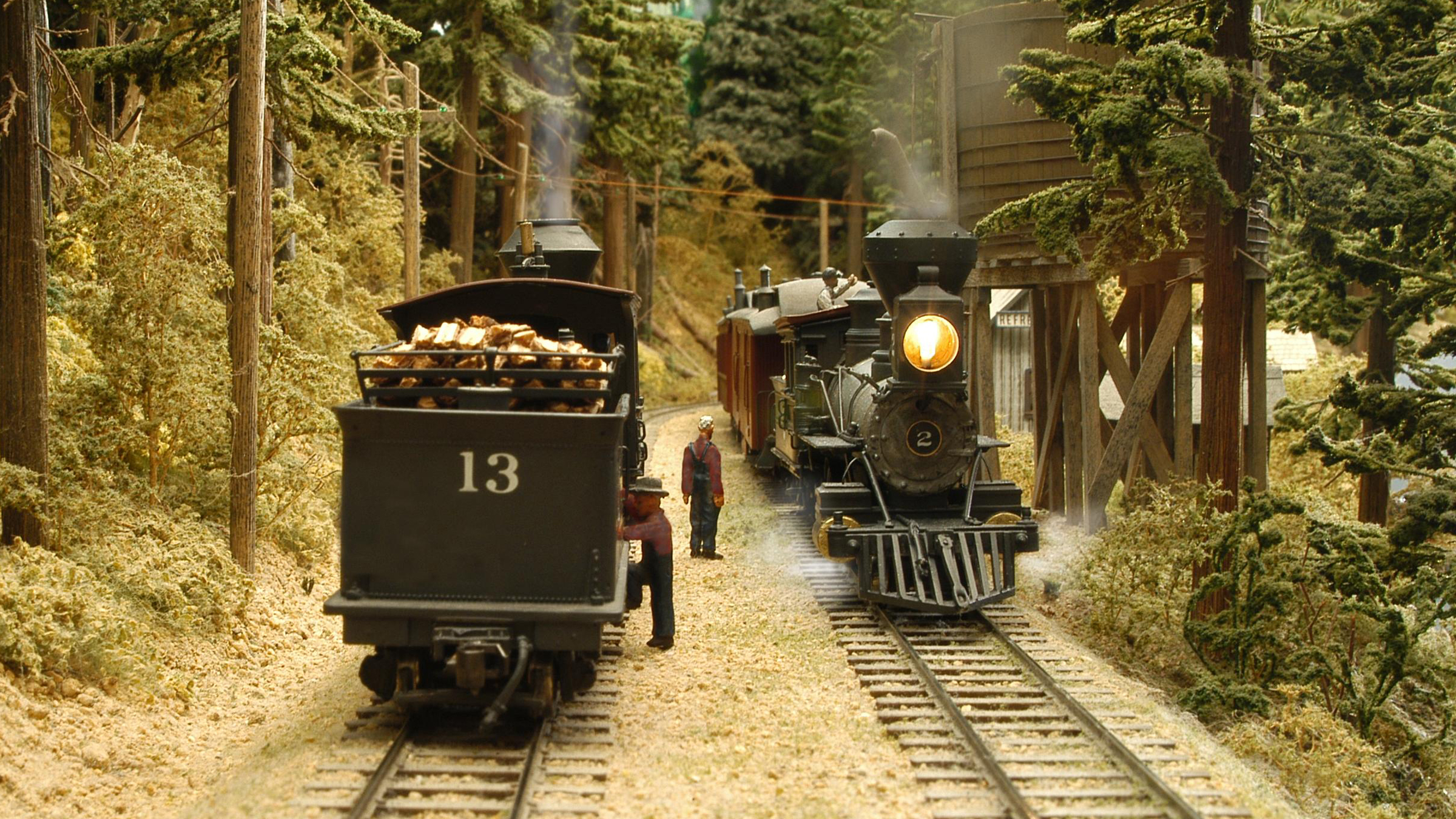 Two model trains on parallel tracks.