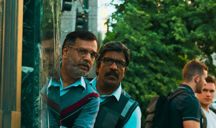 Vivek Elangovan and Vidhyashankar Balasubramaniyan peer around a corner.