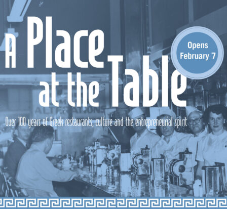 Workers and patrons at the ordering counter in a historic diner.